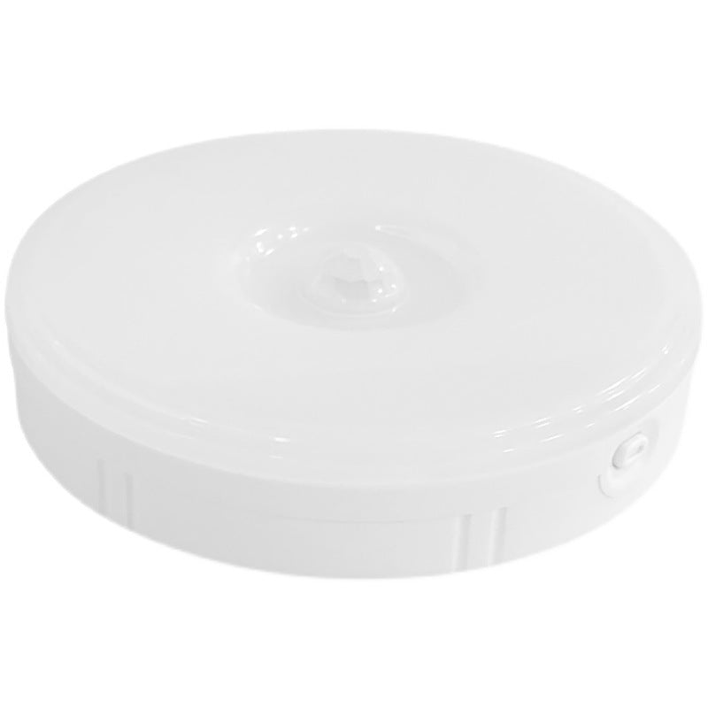 Round rechargeable LED night light with central motion sensor and side button