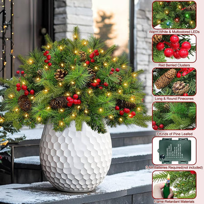 Decorated pine branches, berries, pinecones and battery box