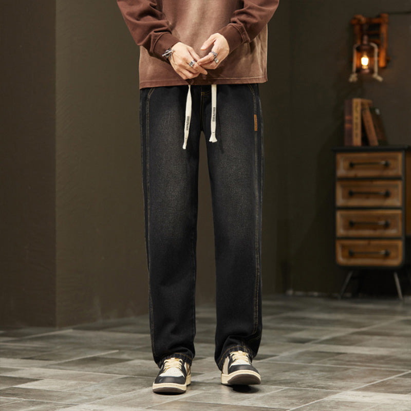 Dark gray jeans worn with a casual top