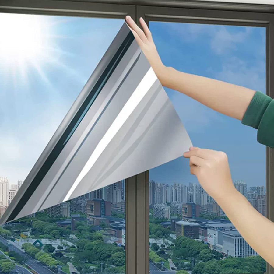 Reflective privacy window film applied to a window
