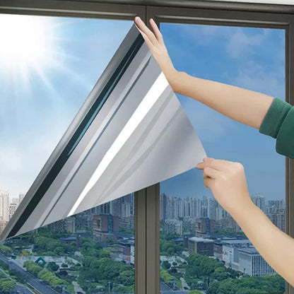 Reflective privacy window film applied to a window