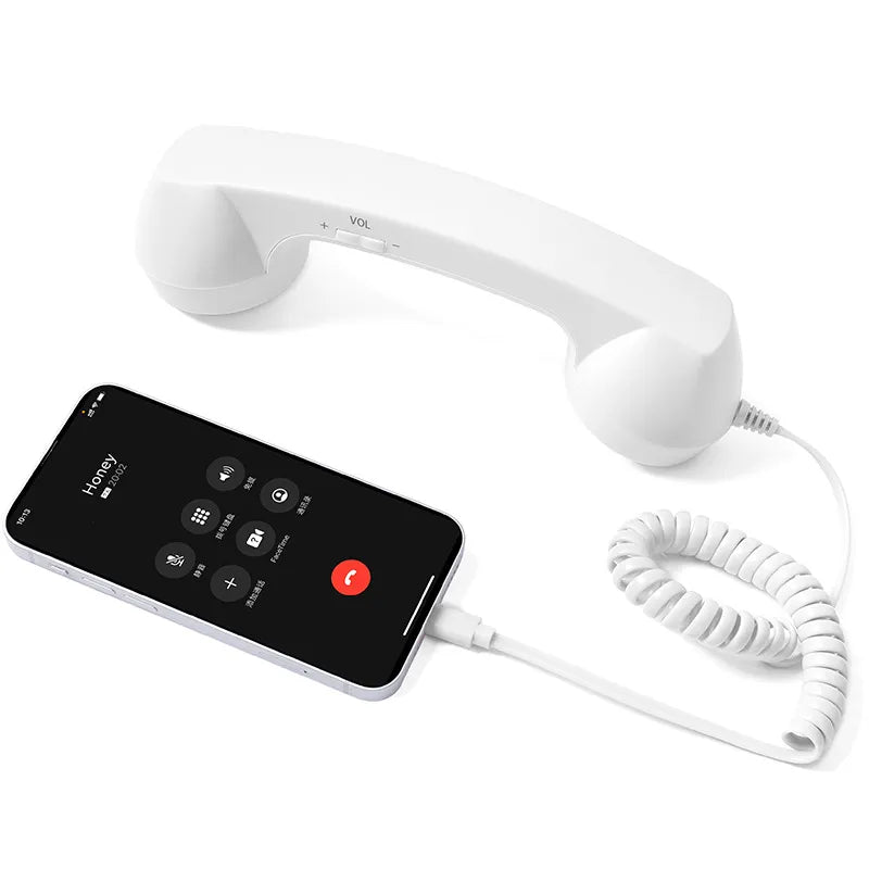 White retro handset with coiled cord and smartphone