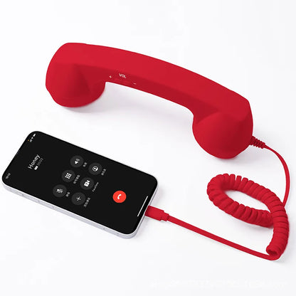 Red retro handset with coiled cord and smartphone