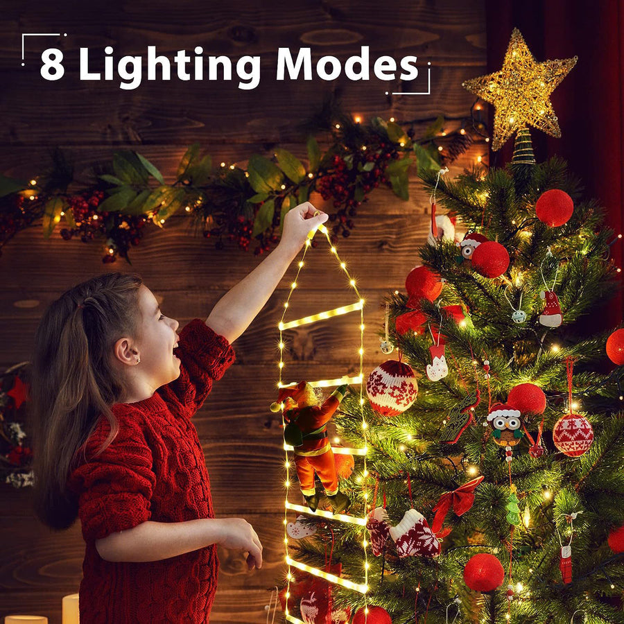 Santa ladder lights beside a Christmas tree