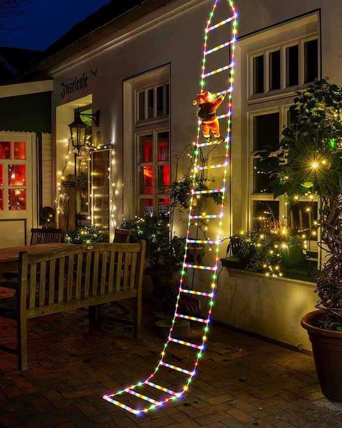 Multicolor Santa ladder lights outside a home