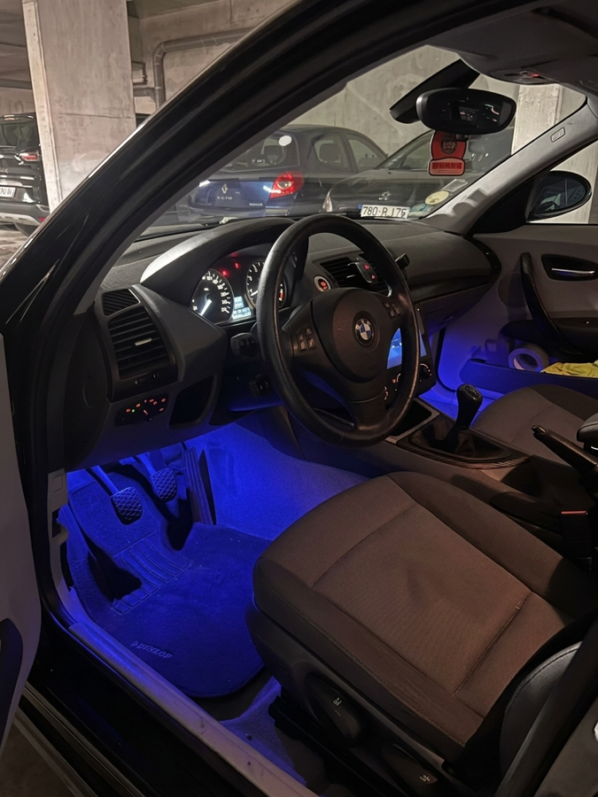 Blue DriveGlow lighting around car footwells