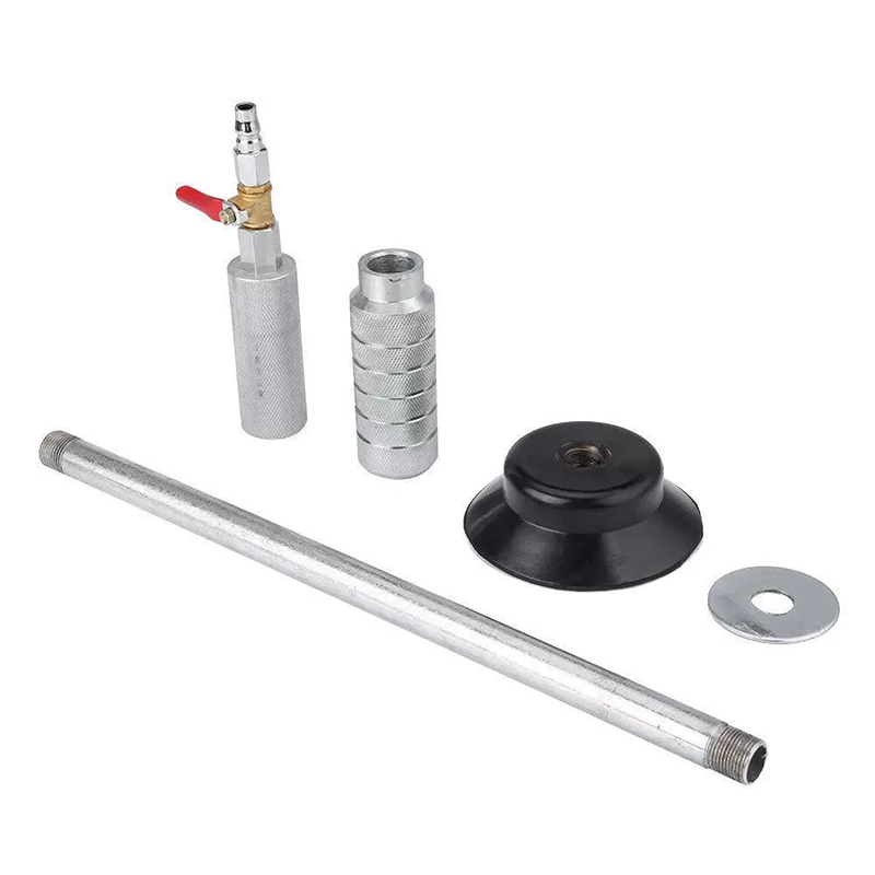 Silver dent puller components laid out for assembly